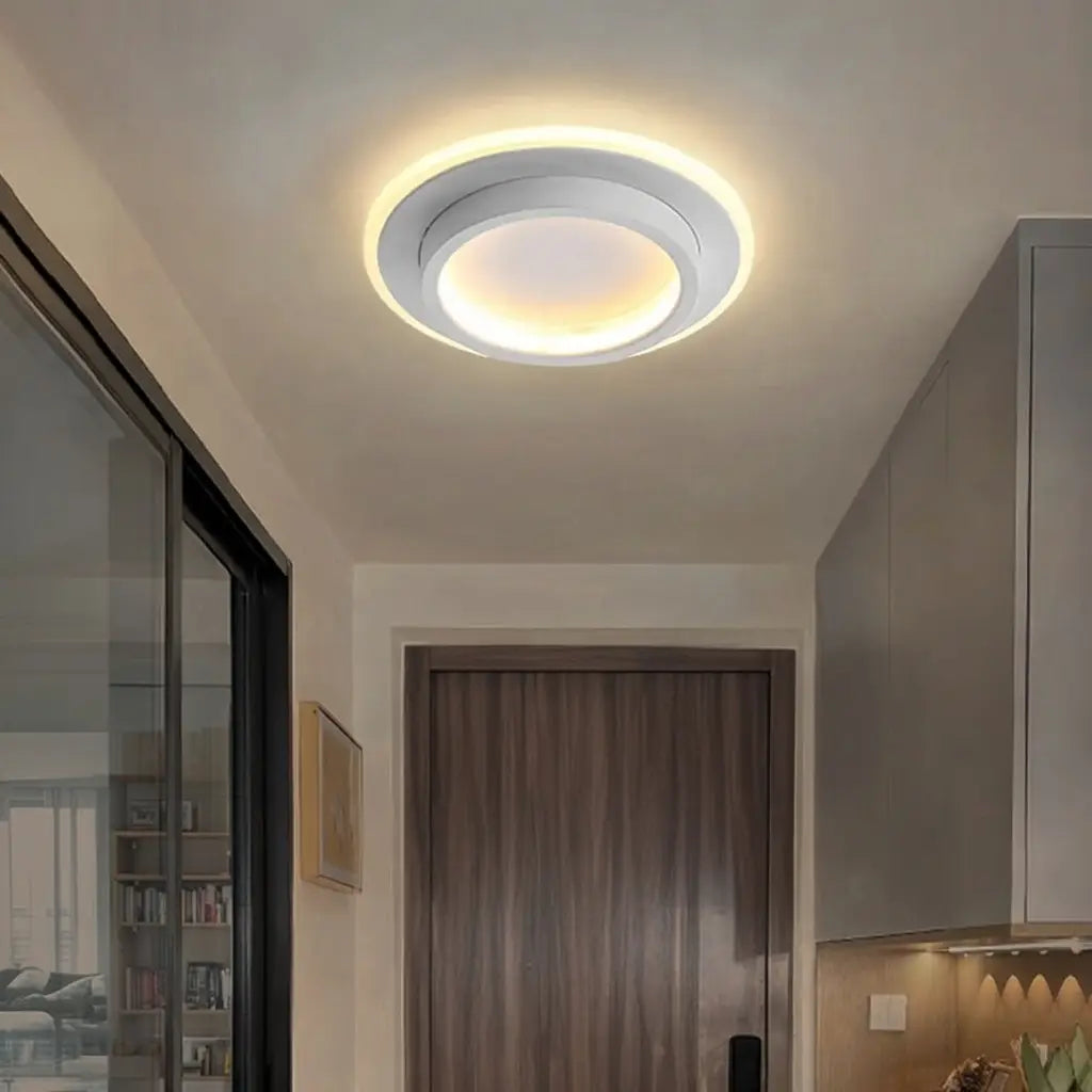 Plafoniera LED a conchiglia con anello luminoso e illuminazione a doppio strato, aderente al soffitto