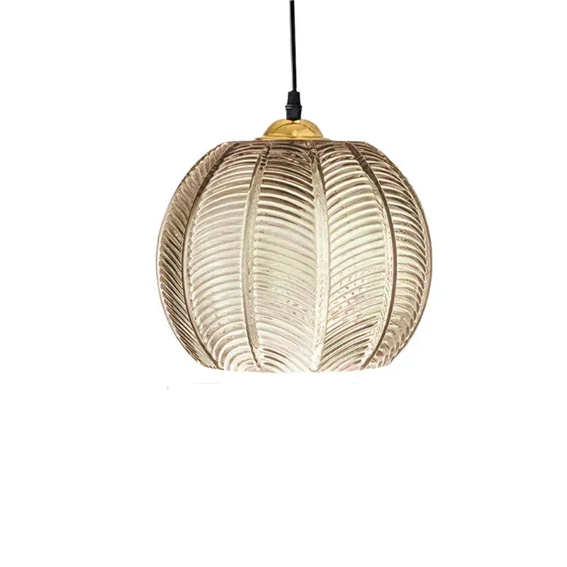 Pendant Light with Leaf-Pattern Glass and Soft Ambient Illumination