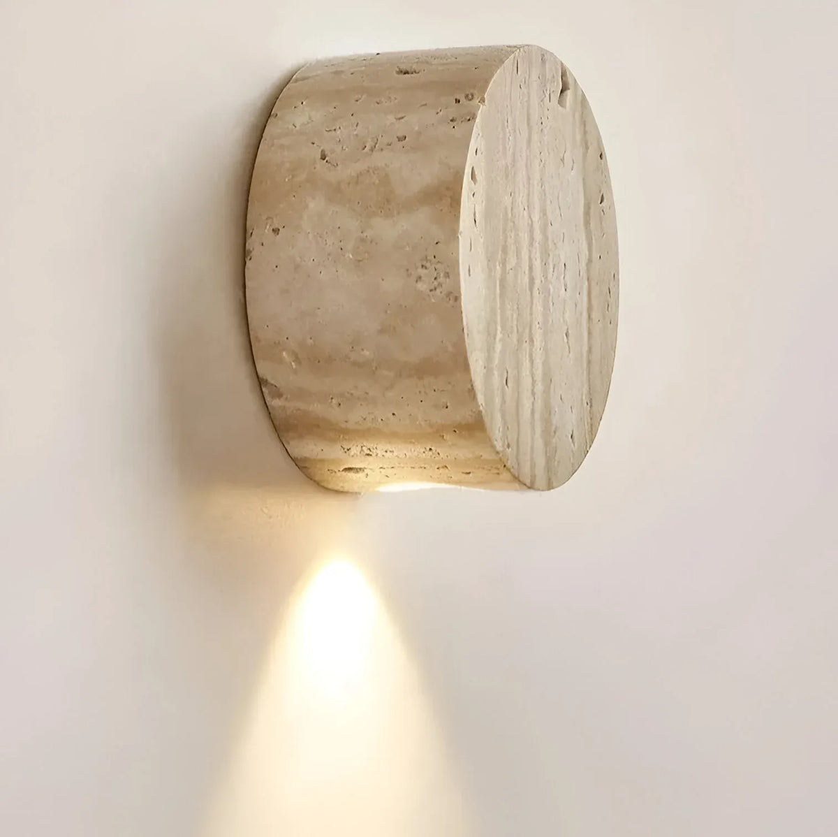 Travertine Minimalist Wall Light with Soft Downlight and Rounded Stone Form
