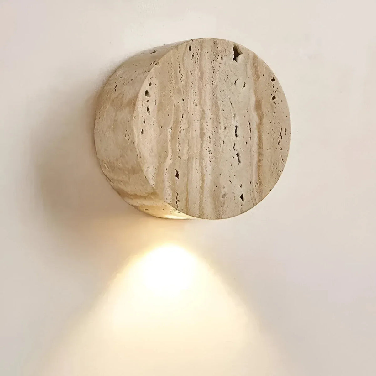 Travertine Minimalist Wall Light with Soft Downlight and Rounded Stone Form