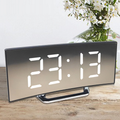 Digital Alarm Clock with Curved Mirror LED Display and Battery Powered Operation - Image 1